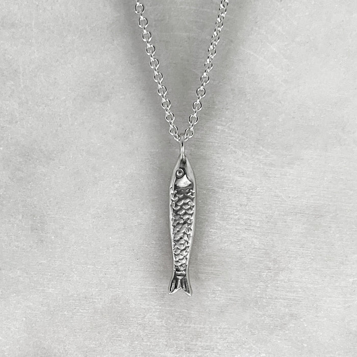 our  sterling Silver fish Necklace, Sardine Necklace hanging on a 925 trace chain.