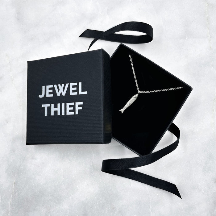the Silver fish Necklace, Sardine Necklace in a jewel thief Brighton gift box.