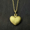 straight on photo of our solid 925 sterling silver heart pendant with a 24k gold vermeil finish