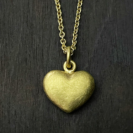 straight on photo of our solid 925 sterling silver heart pendant with a 24k gold vermeil finish