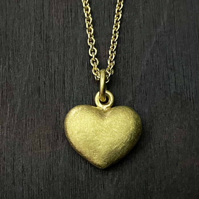 straight on photo of our solid 925 sterling silver heart pendant with a 24k gold vermeil finish