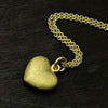 photo of our solid 925 sterling silver heart pendant with a 24k gold vermeil finish