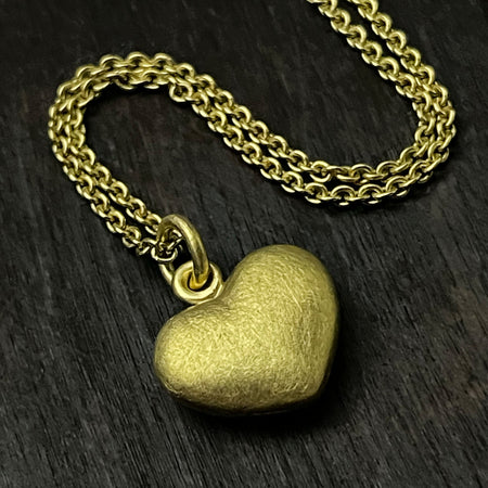 solid 925 sterling silver heart pendant with a 24k gold vermeil finish