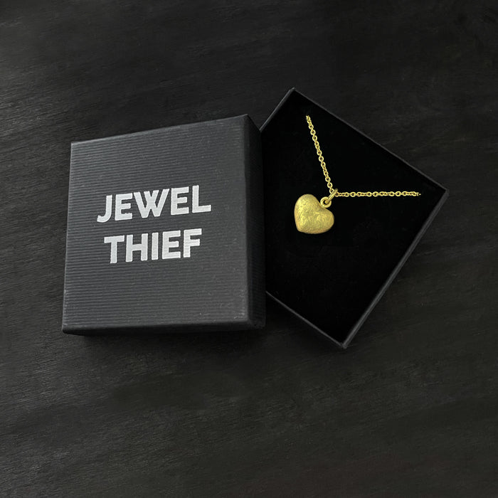 our solid 925 sterling silver heart pendant with a 24k gold vermeil finish in a jewel thief Brighton gift box.