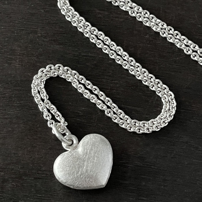 alternative photo of our Solid 925 Sterling Silver three dimensional heart pendant
