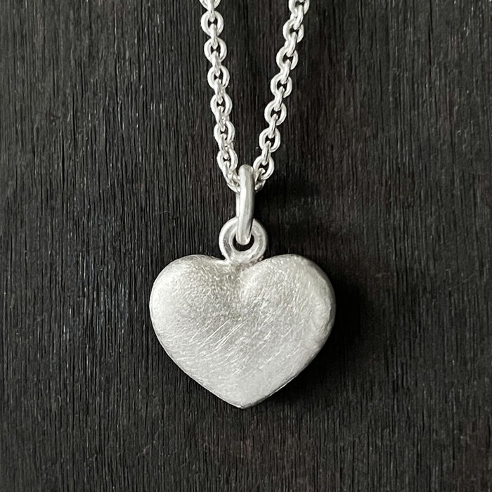 straight on photo of our Solid 925 Sterling Silver three dimensional heart pendant necklace