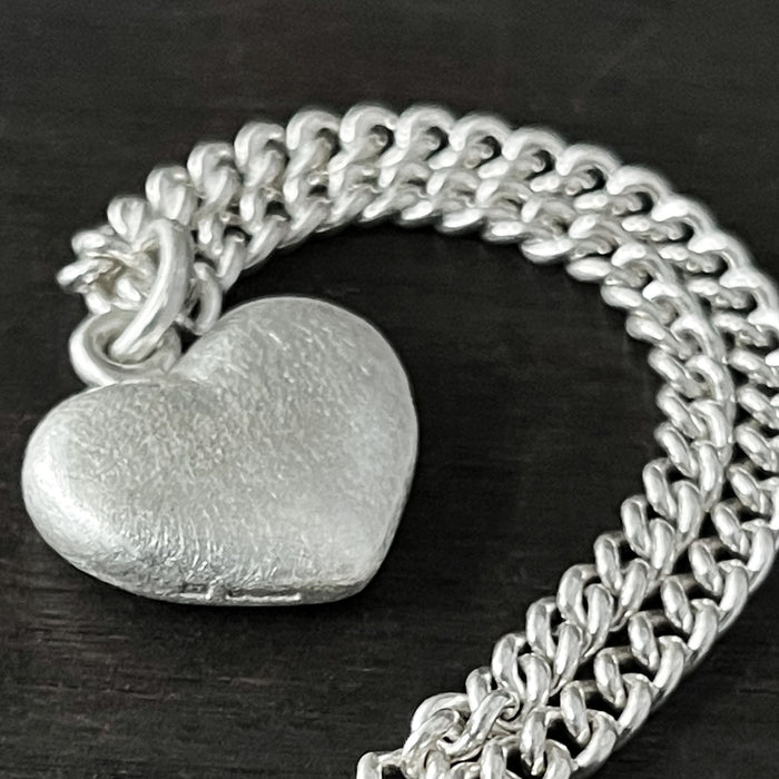 hallmark photo of ur Solid 925 Sterling Silver three dimensional heart pendant on a curb chain.