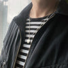photo of our Solid 925 Sterling Silver three dimensional heart pendant shown on a male model.