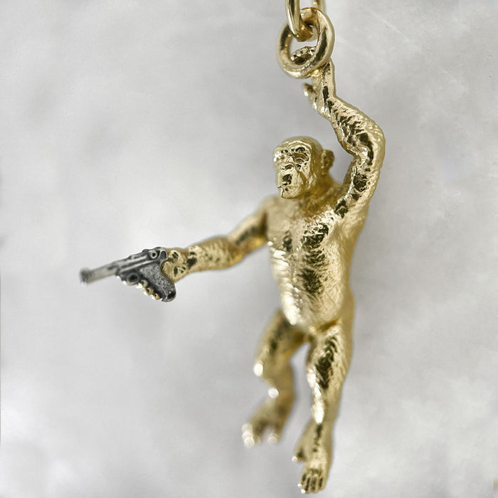 Gold Chimp With A Gun