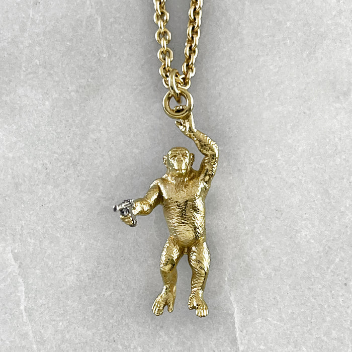 Gold Chimp With A Gun