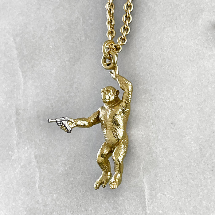 Gold Chimp With A Gun