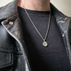 photo of our Alexander the Great Ancient Greek coin pendant necklace by jewel thief Brighton on a male model.
