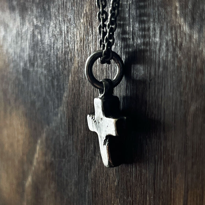 side view of the rustic cross pendant necklace.