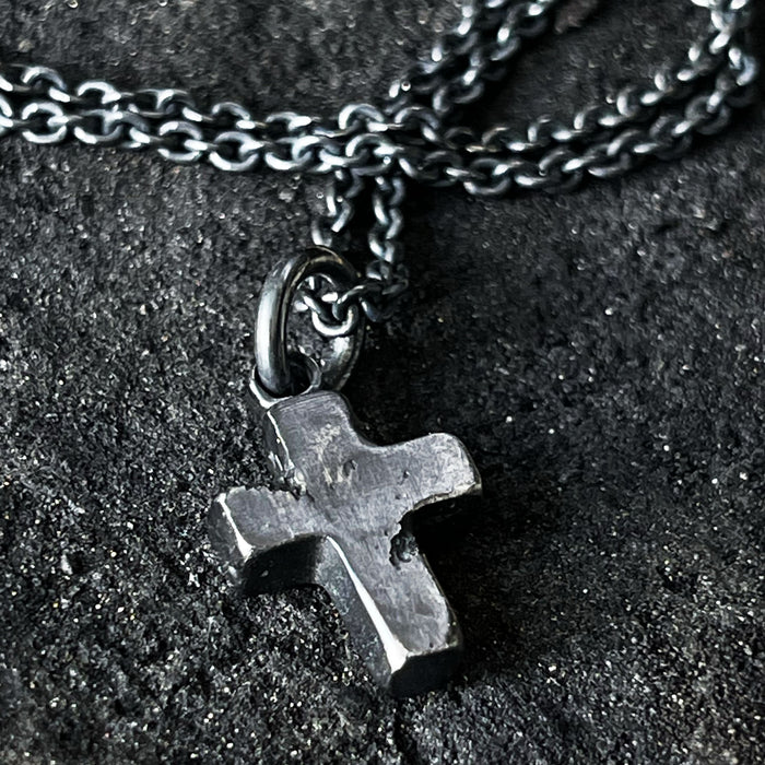 Detail of rustic cross pendant  for men.
