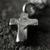 alternative photo showing the texture on the rustic cross pendant.