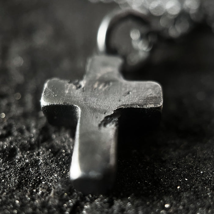alternative photo showing the texture on the rustic cross pendant.