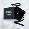 rustic cross pendant  shown in the jewel thief Brighton gift box.