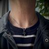 rustic chubby cross pendant necklace on a male model by jewel thief Brighton.