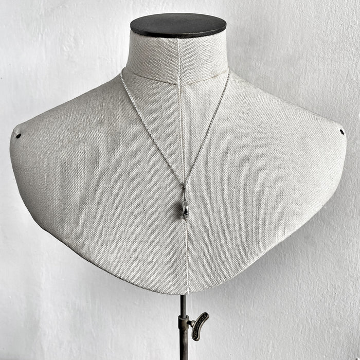 rat pendant on mannequin 