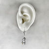 rat earrings on ear