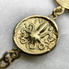 greek coin dangle drop earrings jewel thief Brighton