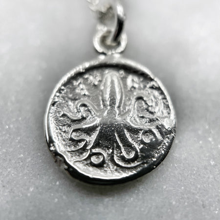 white gold greek octopus coin necklace jewel thief Brighton