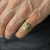 gold skull and crossbones ring on model