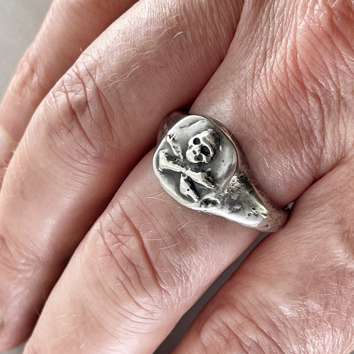 skull and crossbones ring on model