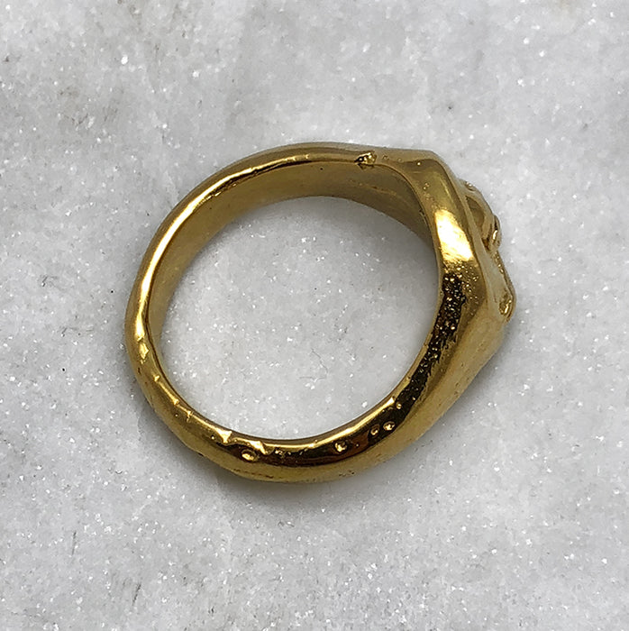 gold skull and crossbones ring side view