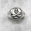 silver skull and crossbones ring top view